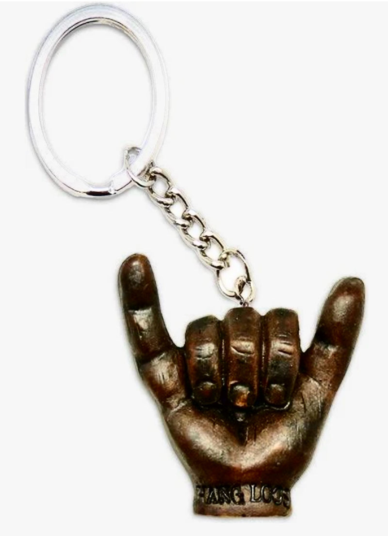 Shaka hand sign keychain with a bronze finish, featuring the "Hang Loose" engraving, symbolizing Hawaiian aloha spirit and laid-back vibes.