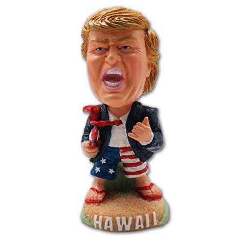 President Trump 4-inch dashboard doll holding surfboard wearing patriotic shorts with "Hawaii" base