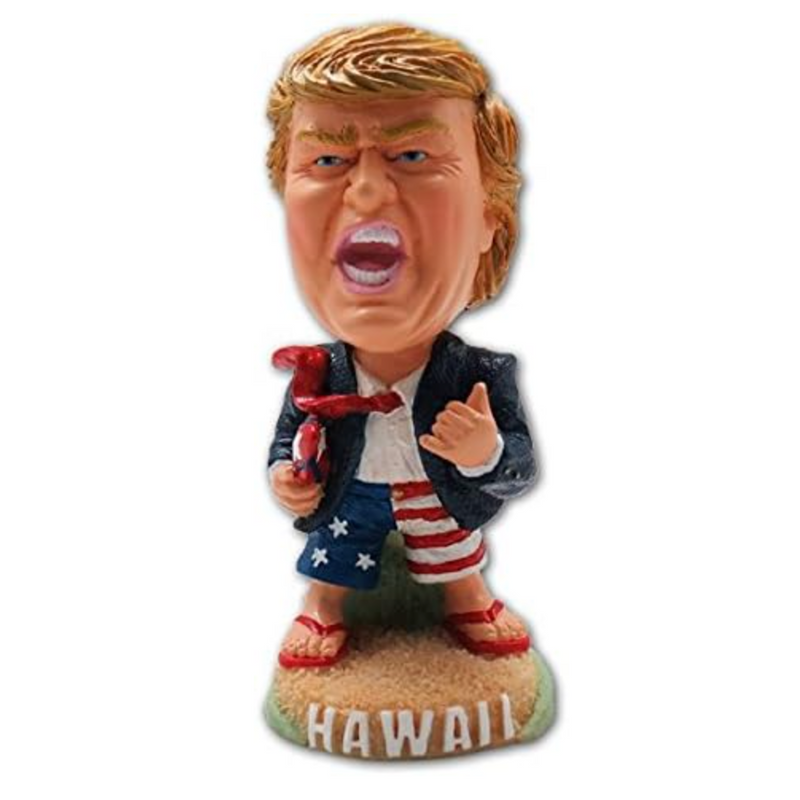 President Trump 4-inch dashboard doll holding surfboard wearing patriotic shorts with "Hawaii" base