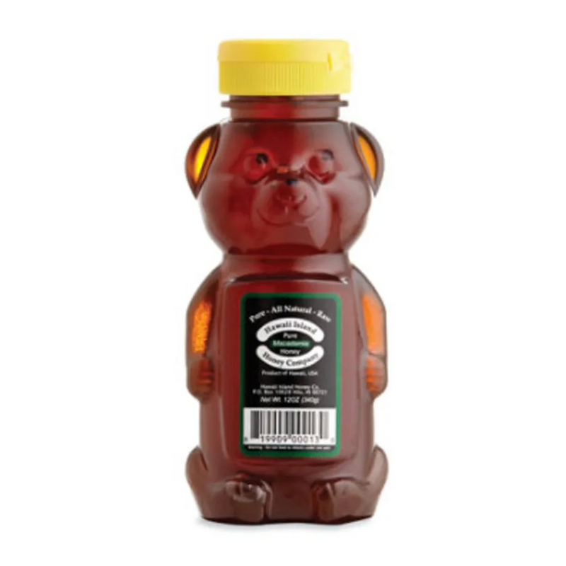 Honey bear bottle with a yellow cap on a white background