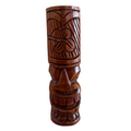 Wooden tiki mug with intricate carvings on a white background