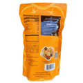 Back of a 16oz bag of Honolulu Cookie Company Minibites – Passion Orange Guava flavor, showing nutrition facts, ingredients list, brand story, and an image of assorted pineapple-shaped cookies.